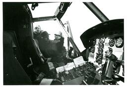 Man Holding Up Children to See inside Helicopter (Part of the NMU Historic Photographs Collection)