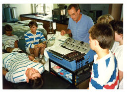 Unknown Instructor Does Experiment with Students at the Seaborg Summer Science Academy