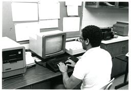 Student Typing on Early Computer--Vocational Education (Part of the NMU Historic Photographs Collection)