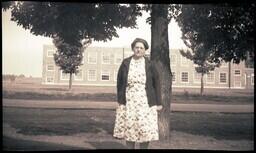 (043-008) Older Woman Standing in Front of School