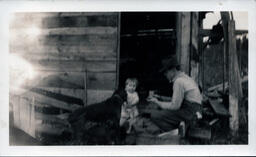 Man Presenting Object to Young Tom Ross