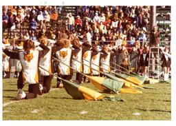 Color Guard Kneeling with Flags on Football Field (Part of the NMU Historic Photographs Collection)