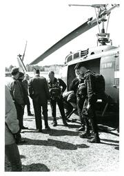 Group of People Talking next to Helicopter (Part of the NMU Historic Photographs Collection)