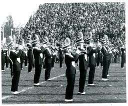 Side View of Marching Band Performing at Football Game (Part of the NMU Historic Photographs Collection)