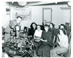 Instructor Teaching Students about Engine (Part of the NMU Historic Photographs Collection)