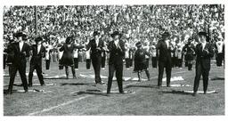 Flag Twirlers Dancing during Routine (Part of the NMU Historic Photographs Collection)