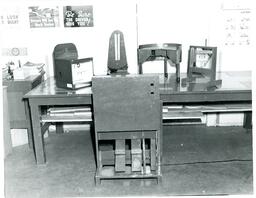 Driving Practice Machine Instructor Teaching Students about Engine (Part of the NMU Historic Photographs Collection)