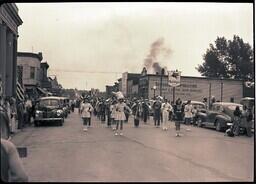 (050-019) Marching Band and Baton Twirlers March near Mobilgas in Ontonagon Labor Day Parade