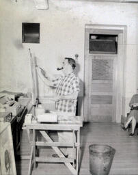 Artist J. Martin Summer 1958: Side View of J. Martin Painting a Canvas