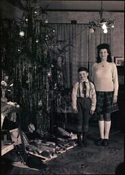 (078-007) Delores and Dan Dobbek with Christmas Tree