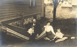 People on a lawn with hammock