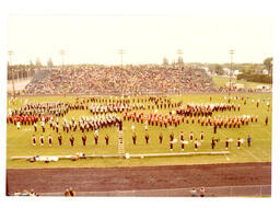 Multiple Marching Bands Performing on Football Field (Part of the NMU Historic Photographs Collection)