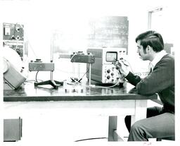 Man Looking at Waves on Monitor (Part of the NMU Historic Photographs Collection)