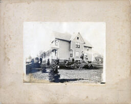 House with People Scattered in Yard