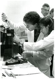 Two Students Doing Lab Experiment (Part of the NMU Historic Photographs Collection)