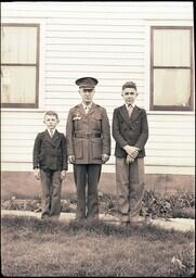 (079-002) Man in Uniform with Two Boys