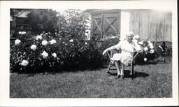 Woman Sitting Outside in Chair