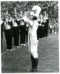 Drum Major Conducting Marching Band (Part of the NMU Historic Photographs Collection)