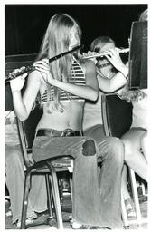 Student Playing Flute in Crop Top (Part of the NMU Historic Photographs Collection)