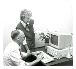 Man Learning How to Use an Early Computer (Part of the NMU Historic Photographs Collection)