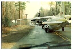 Pickup Trucks Towing Planes (Part of the NMU Historic Photographs Collection)