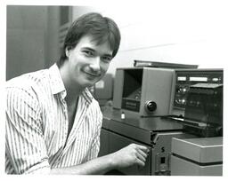 Student Turning Key in Machine (Part of the NMU Historic Photographs Collection)