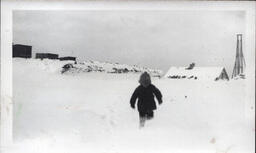 Young Tom Ross Running Through Snow