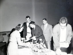 Parents Day 1958: Students and Parents Standing Around Table