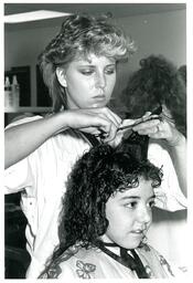 Student Cutting a Child’s Hair (Part of the NMU Historic Photographs Collection)