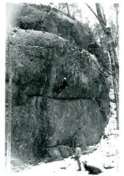 Person Rappelling down Snowy Cliff (Part of the NMU Historic Photographs Collection)