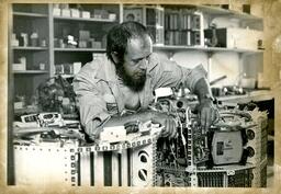 Man Looking over Electrical Equipment (Part of the NMU Historic Photographs Collection)