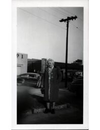 Woman Standing Near Car Garage "Down South"