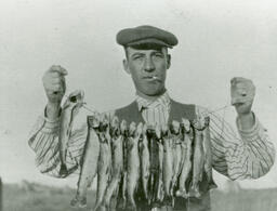 Christ Rigoni with string of fish