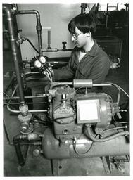 Student Working on Car Hydraulics (Part of the NMU Historic Photographs Collection)