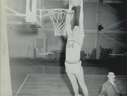 Basketball Teams and Individuals 1959-1960: Basketball Player Dunking Ball