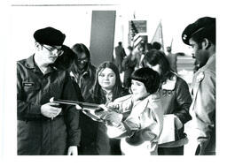 Eslinger and Unknown Military Man Showing Children How to Shoot a Gun (Part of the NMU Historic Photographs Collection)