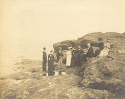 People on rock shoreline of Lake Superior (3 of 3)