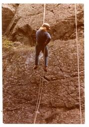 Back View of Person Rappelling Down a Cliff (Part of the NMU Historic Photographs Collection)