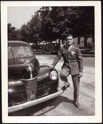 Man (Norman Fabry?) with Foot on Car