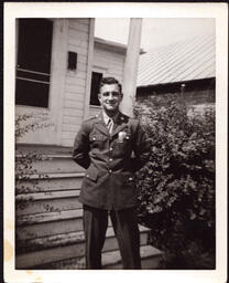 Man (Norman Fabry?) next to House