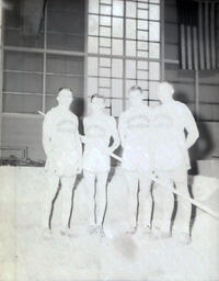 NMC Track Team 1961: Overexposed Photo of Four Track Athletes