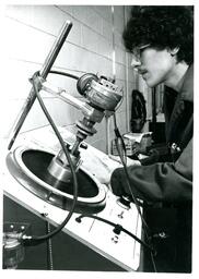 Student Working with Electronic Machine (Part of the NMU Historic Photographs Collection)