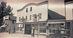 (004-008) Exterior Side View of an Ice Cream Parlor, Lakeside Garage, and the White Eagle Hotel