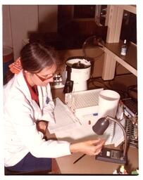 Woman Doing Experiment in Lab (Part of the NMU Historic Photographs Collection)