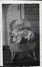 Baby with Bonnet in Chair (2 of 2)