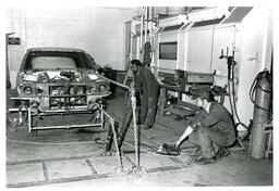 Two Students Operating Car Lift (Part of the NMU Historic Photographs Collection)